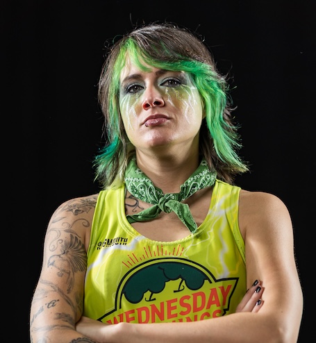 T-Wrecks looks seriously at the camera with green hair